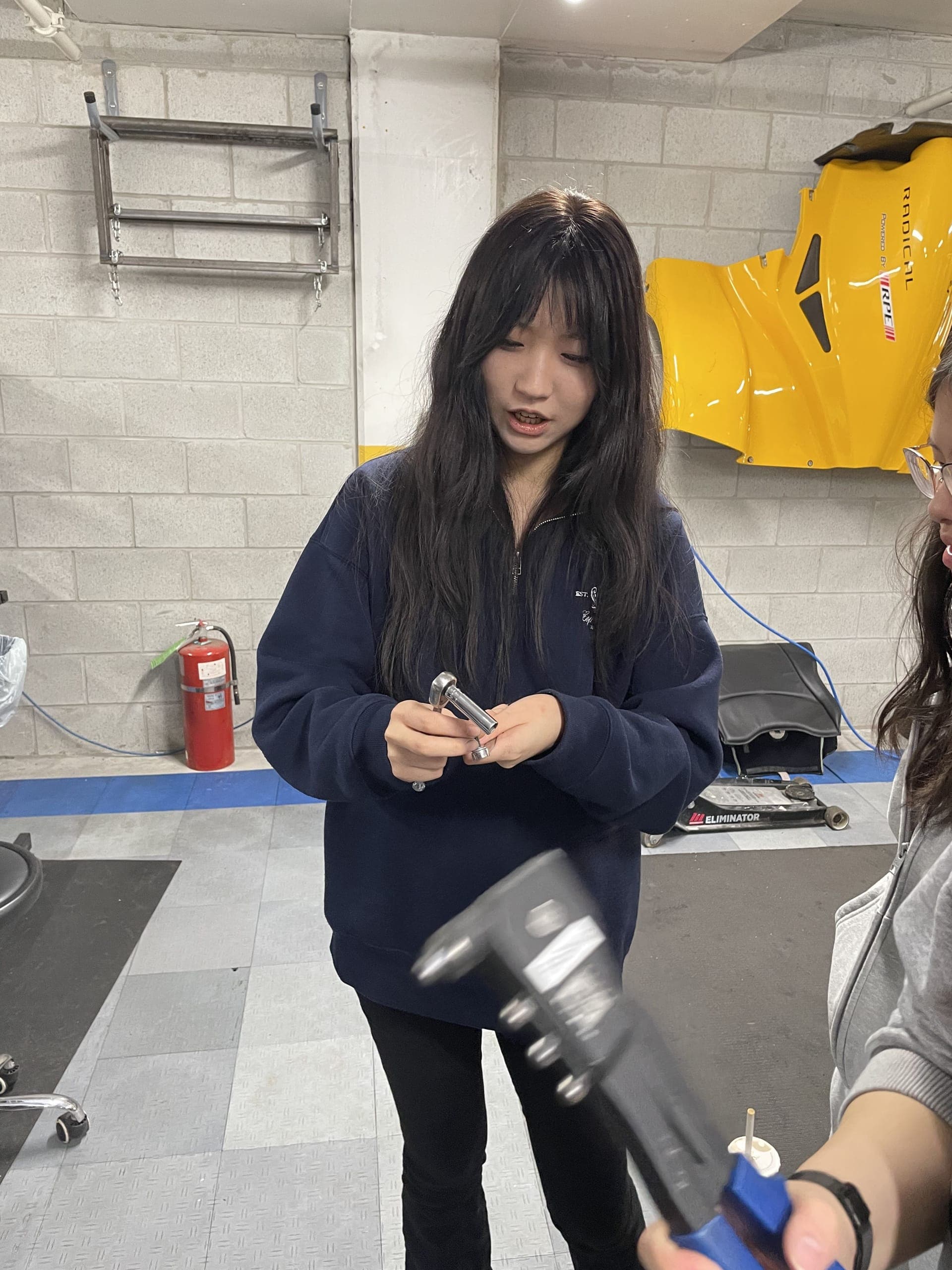 Students hands-on with EV mechanical assembly in the workshop