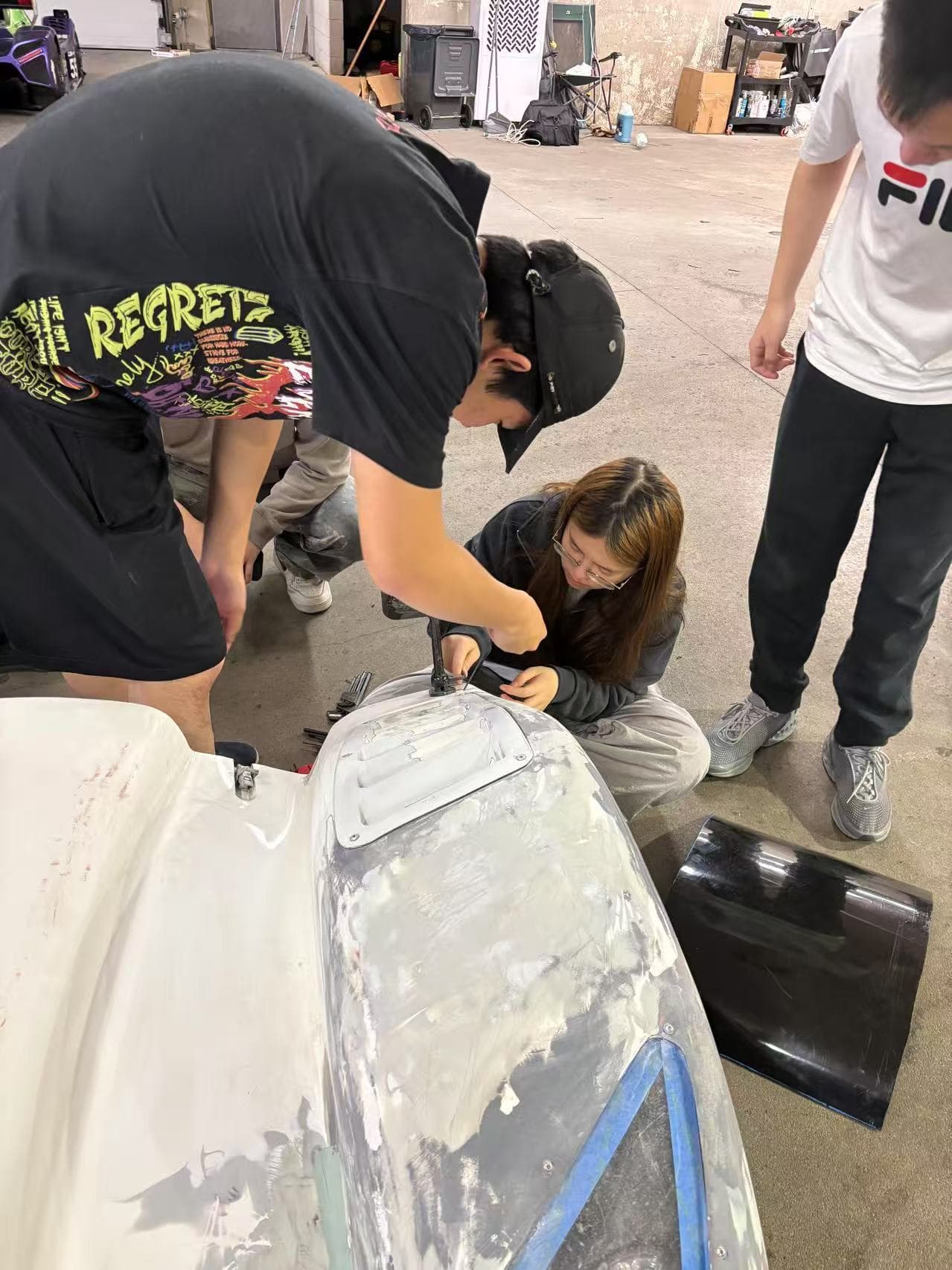 Team collaborating on body shell modifications